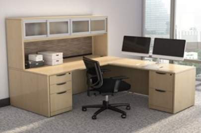 Light colored L-shaped Desk with two monitors on it